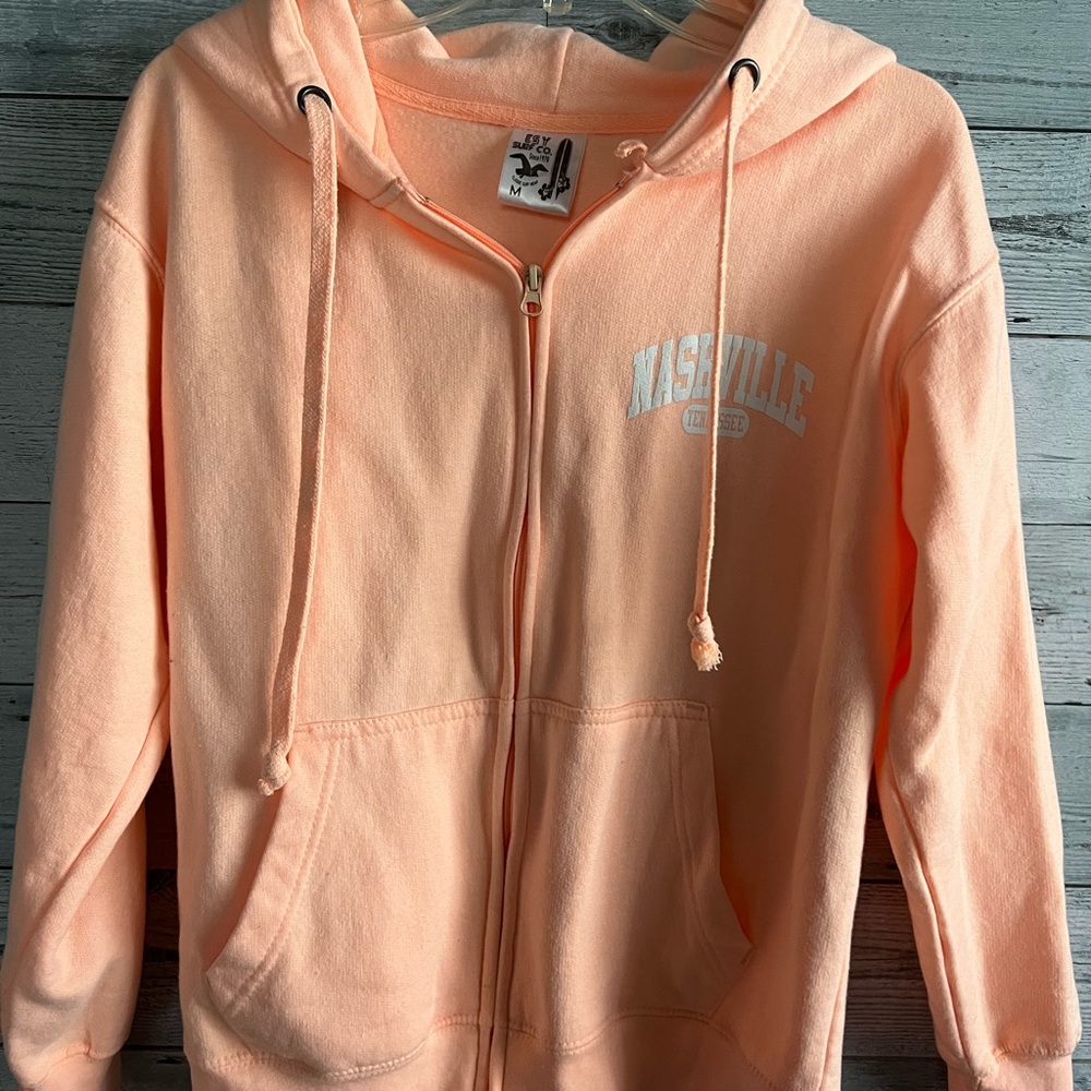 Peach colored Nashville Tennessee zip up sweatshirt!